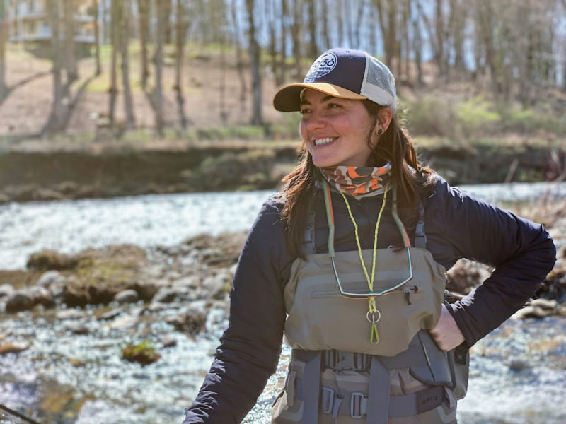 Caitie posing for the camera in full fishing gear