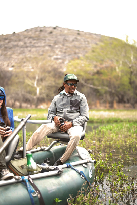 Alvin Dedeaux relaxing in an Orvis drift boat