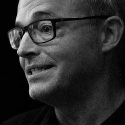A black-and-white headshot of Dr. Stephen Davis