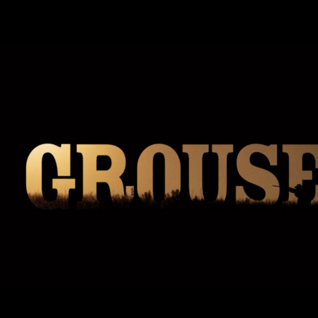 The movie title Grouseman in gold against a black background.