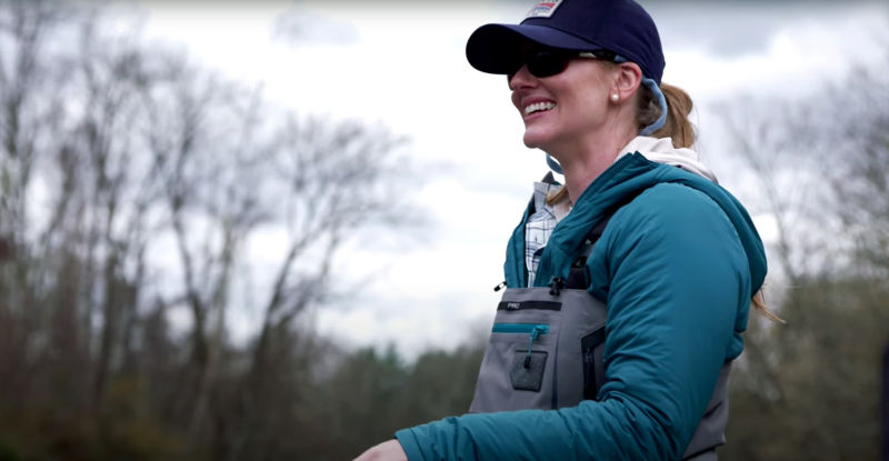 An angler wearing many layers while fishing.