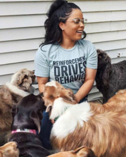 Melinda surrounded by dogs