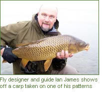 Fly designer and guide Ian James shows off a carp taken on one of his patterns