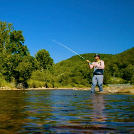Pete Kutzer teachs a fishing lesson in a Vermont stream